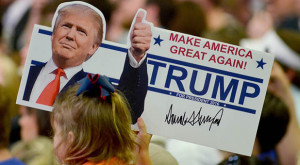 A young supporter holds up a campaign sign for U.S. Republican Presidential candidate Donald Trump at Madison Central High School during at a campaign rally in Madison, Mississippi March 7, 2016. REUTERS/Rick Guy